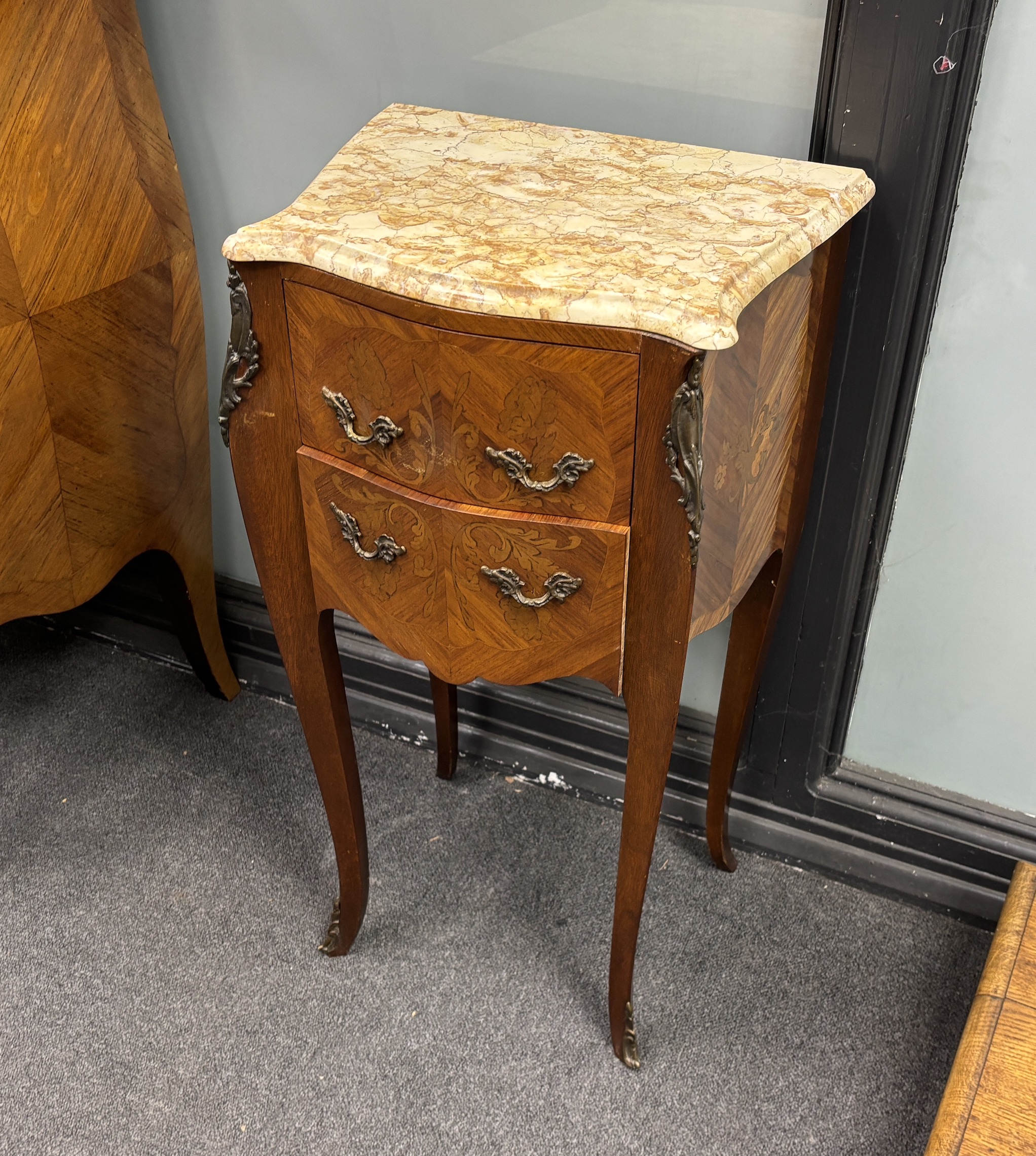 A pair of Louis XVI style inlaid kingwood marbled top serpentine bedside chests, width 42cm, depth 31cm, height 75cm